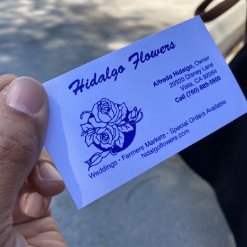Temecula Farmer's Market - a person holding a business card - Farmers Market Near Me - Temecula, California Temecula Farmer's Market - a person holding a business card - Farmers Market Near Me - Temecula, California
