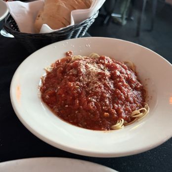 Umberto's - Side of marinara sauce with pasta served with my Chicken Marsala - Italian Near Me - North Myrtle Beach, South Carolina