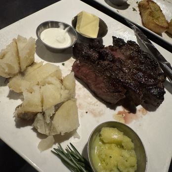 Matthew's Steakhouse - Half of an 18oz ribeye.. with baked potato. - Steakhouses Near Me - Winter Garden, Florida