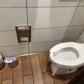 McDonald's - a toilet and trash can in a public restroom - Fast Food Near Me - Fredericksburg, Virginia
