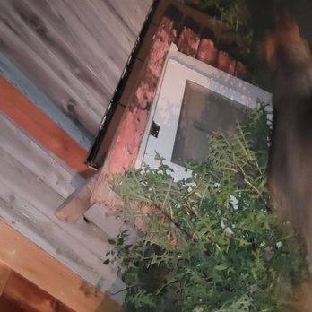 Bryan and Sons Junk Removal - Old broken in half back door, old wood gate, old security iron door - Junk Removal & Hauling Near Me