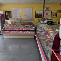 Cajun Meat Company - Small store with a variety of seasoned meats and sausages.
