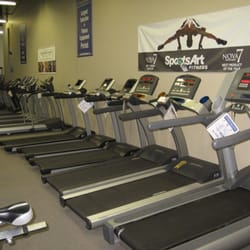 Fitness Town - The wall of treadmills... enough choices for every person's needs.