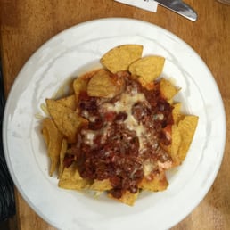 Nachos with tomato salsa, jalapeños, cheese, and chili