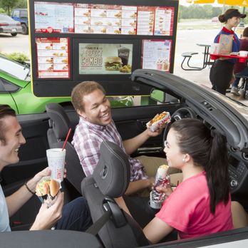 Sonic Drive-In - three people eating hot dogs in a car - Burgers Near Me - Lincoln, Nebraska Sonic Drive-In - three people eating hot dogs in a car - Burgers Near Me - Lincoln, Nebraska