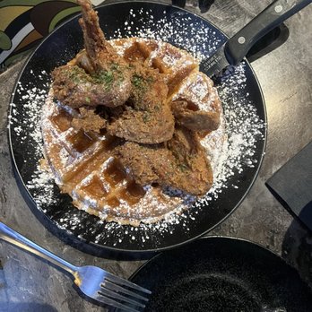 Nouveau Noir - Chicken and waffles served with pineapple glaze - Southern Near Me - Dallas, Texas Nouveau Noir - Chicken and waffles served with pineapple glaze - Southern Near Me - Dallas, Texas