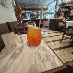 Excellent and generous Aperol Spritz, served with a lemon slice and lots of ice , nice paper straw. Excellent and generous Aperol Spritz, served with a lemon slice and lots of ice , nice paper straw.