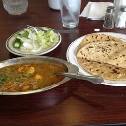 I had samosas topped with chutney and channa, chicken masala and rotis. Short menu but authentic, tasty food.