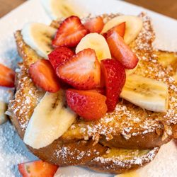 Golden Basket Breakfast Club - Coconut French Toast - Thick slices of fresh bread dipped in batter then straight into coconut flakes for a crispy delight in every bite.