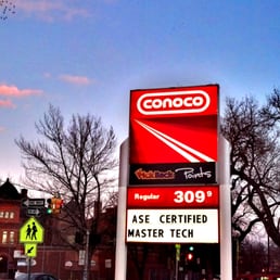 a gas station with a large sign