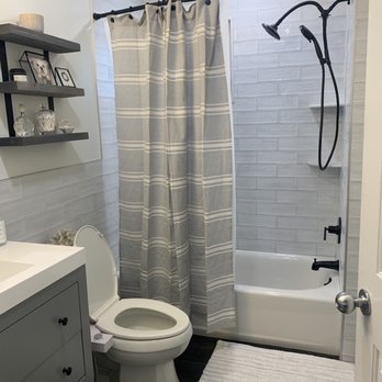 Supreme Kitchens & Baths - a bathroom with a toilet and shower - General Contractors Near Me - Freeport, New York