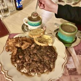 Red beans & Rice topped with fried chicken and cups of gumbo. Red beans & Rice topped with fried chicken and cups of gumbo.