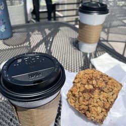 Steaming Bean - Small coffee and a blueberry oatmeal muffin out on the patio