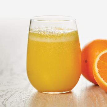 Egg N' Joe - glass of orange juice next to an orange - American Near Me - Gilbert, Arizona Egg N' Joe - glass of orange juice next to an orange - American Near Me - Gilbert, Arizona