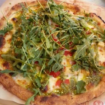 Blaze Pizza - Green Stripe: pesto, garlic, and arugula over chicken, red pepper, and cheese - Pizza Near Me - Irvine, California Blaze Pizza - Green Stripe: pesto, garlic, and arugula over chicken, red pepper, and cheese - Pizza Near Me - Irvine, California