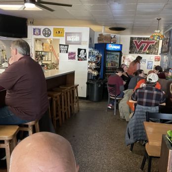 Souvlaki - a man sitting at a bar - Greek Near Me - Blacksburg, Virginia Souvlaki - a man sitting at a bar - Greek Near Me - Blacksburg, Virginia