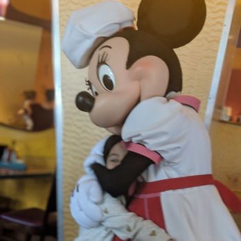 Goofy's Kitchen - Minnie hugging and giving an autograph. - American Near Me - Anaheim, California