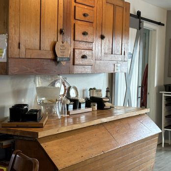 Goat Farm Coffee House - a kitchen with wooden cabinets - Coffee & Tea Near Me - Forney, Texas