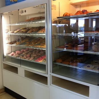 Odalys Bakery - a display case full of donuts - Imported Food Near Me - Charlotte, North Carolina
