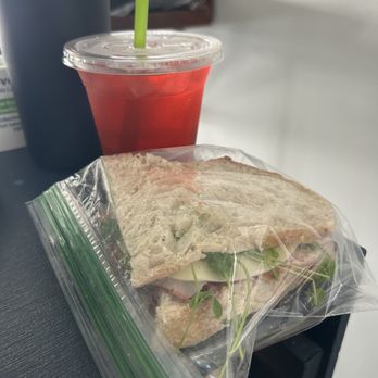SunnySide Coffee - Raspberry Passion Fruit Tea w/ Ham Sandwich - Coffee & Tea Near Me - Tawas City, Michigan