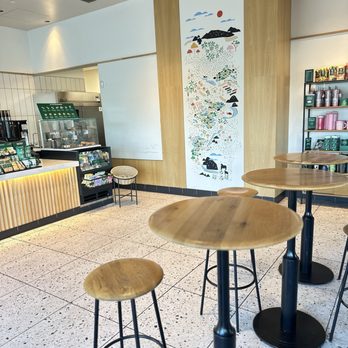 Starbucks - Seating inside , wall art, cups, coffee , order counter - Coffee & Tea Near Me - Rancho Mirage, California