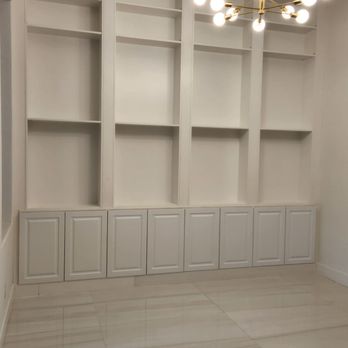 Cam Remodeling - "A custom wall unit, built-in and sleek, finished in crisp white for a clean, modern look that seamlessly blends with the room." - Flooring Near Me Cam Remodeling - "A custom wall unit, built-in and sleek, finished in crisp white for a clean, modern look that seamlessly blends with the room." - Flooring Near Me