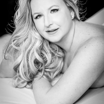 Valerie Visser Studios - Black and white image of a woman posed looking at the camera for boudoir session set with sheets. - Boudoir Photography Near Me - Grand Rapids, Michigan Valerie Visser Studios - Black and white image of a woman posed looking at the camera for boudoir session set with sheets. - Boudoir Photography Near Me - Grand Rapids, Michigan
