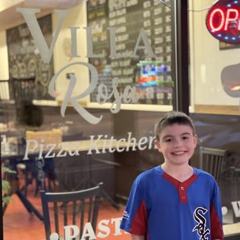 Villa Rosa Pizza Kitchen - Kid after game ready for his slice - Pizza Near Me - Chicago, Illinois Villa Rosa Pizza Kitchen - Kid after game ready for his slice - Pizza Near Me - Chicago, Illinois