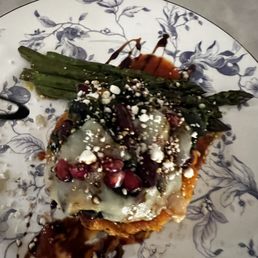 Stuffed Squash with Black Beans, Feta and Pomegranate on Asparagus (there's also a vegan version) Stuffed Squash with Black Beans, Feta and Pomegranate on Asparagus (there's also a vegan version)