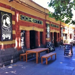 Hair Guy - A look down the 'Banana Alley' group of businesses that front Flinders St. Hair Guy is first on the left.