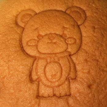 Mr Bear - Closeup shot of the Mr. Bear Logo on the Cake - Desserts Near Me - Queens, New York