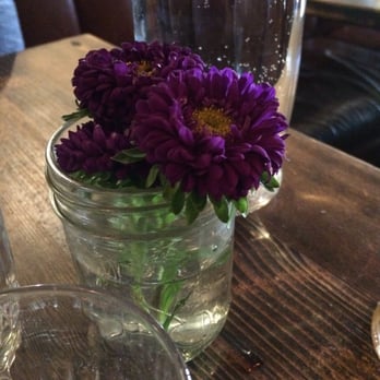 The Parlour - Flowers on the table. - Pizza Near Me - Vancouver, British Columbia