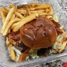 Secret sauce burger with bacon added and a side of fries.