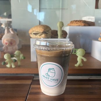 Must Have Coffee - Hojicha latte in front of their bakery display - Coffee & Tea Near Me - Monterey Park, California