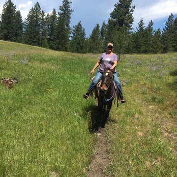 Lonesome Dove Guest Ranch - Wife on  Lonesome Dove horseback ride - Hotels Near Me - Kalispell, Montana