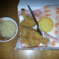 Popeyes Louisiana Kitchen - Compare the size of the wings to the biscuit.... and the cup of red beans and rice isn't even filled