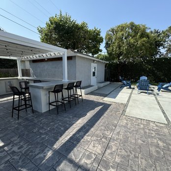 Platinum Paving & Landscaping - New outdoor kitchen with additional seating area and fire pit. - Landscaping Near Me