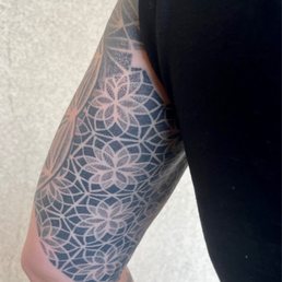 Half tattoo sleeve, upper arm Half tattoo sleeve, upper arm