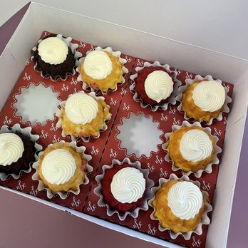 Nothing Bundt Cakes - Bundtinis--from left to right: Chocolate chocolate chip, white chocolate raspberry, red velvet, lemon. - Bakeries Near Me - Louisville, Kentucky Nothing Bundt Cakes - Bundtinis--from left to right: Chocolate chocolate chip, white chocolate raspberry, red velvet, lemon. - Bakeries Near Me - Louisville, Kentucky