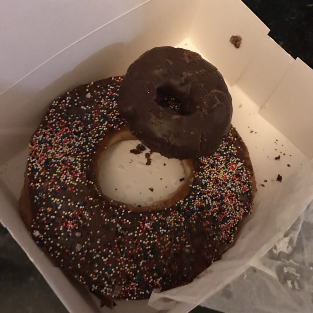 Not Just Donuts - Giant donut with regular chocolate covered chocolate cake donut. - Donuts Near Me - Slidell, Louisiana