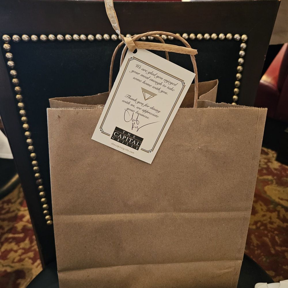 The Capital Grille - To go bone featuring the cutest purse to exist - Steakhouses Near Me - Minneapolis, Minnesota