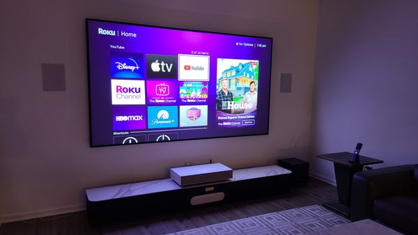 Streamlined Entertainment Lounge - A sleek lounge setup designed for effortless streaming and relaxation. Features a large, wall-mounted screen with ambient backlighting and a minimalist media console for a clean, modern look. Streamlined Entertainment Lounge - A sleek lounge setup designed for effortless streaming and relaxation. Features a large, wall-mounted screen with ambient backlighting and a minimalist media console for a clean, modern look.