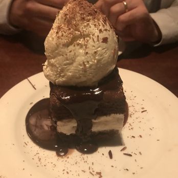 Glenwood's - Chocolate Uprising - Chocolate brownie sandwich with vanilla ice cream on a bed of salted caramel and topped with homemade whipped cream - American Near Me - Columbia, Maryland Glenwood's - Chocolate Uprising - Chocolate brownie sandwich with vanilla ice cream on a bed of salted caramel and topped with homemade whipped cream - American Near Me - Columbia, Maryland