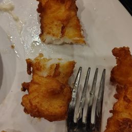The world's tiniest fish in the fish n' chips. Literally two bites. Such a ripoff. The world's tiniest fish in the fish n' chips. Literally two bites. Such a ripoff.