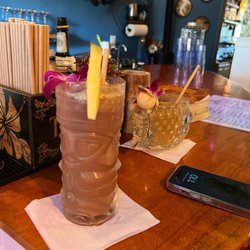 Aumakua Kava Lounge - Taking Kava shots and learning from Adesh. This drinks are awesome!
