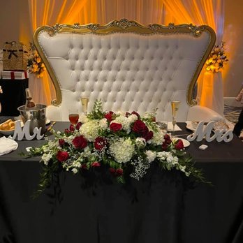 Freesia Designs - Sweetheart table. We rented to sweetheart chair and collaborated on backdrop design, lighting, long and low arrangement for the table. - Party & Event Planning Near Me - San Antonio, Texas