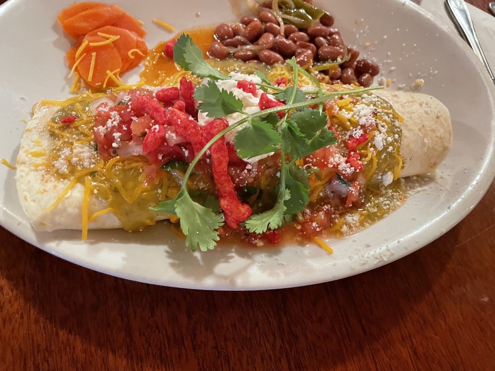 Vaquero Breakfast burritos with a little hot Cheetos garnish. Yelp