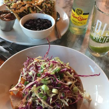 Dish Society - Baked sweet potato with brisket & the chimichuri steak tacos. - New American Near Me - Katy, Texas