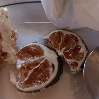 The Hayden - Dried up brown lime slice garnish on key lime pie. - Bars Near Me - San Antonio, Texas