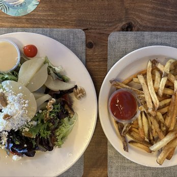 The Dubliner on the Delaware - Left: white plate with pear salad. Right: plate of fries. - Irish Near Me - New Hope, Pennsylvania The Dubliner on the Delaware - Left: white plate with pear salad. Right: plate of fries. - Irish Near Me - New Hope, Pennsylvania